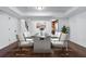 Staged basement dining area with hardwood floors and modern furniture at 706 Twin Brooks Se Ct, Marietta, GA 30067