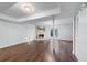 Spacious basement with dark wood floors, fireplace, and access to the outdoors through double doors at 706 Twin Brooks Se Ct, Marietta, GA 30067