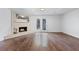 Basement featuring a cozy fireplace and double doors leading to the outside at 706 Twin Brooks Se Ct, Marietta, GA 30067
