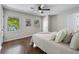 Bedroom with hardwood floors, natural light, and neutral decor creating a relaxing atmosphere at 706 Twin Brooks Se Ct, Marietta, GA 30067