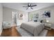 Staged bedroom featuring a queen bed, rug, modern furniture, and colorful art at 706 Twin Brooks Se Ct, Marietta, GA 30067