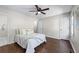 Bright bedroom with hardwood floors, neutral paint, and a ceiling fan at 706 Twin Brooks Se Ct, Marietta, GA 30067