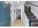 Inviting foyer featuring tile flooring, staircase with wooden treads, and views of other rooms at 706 Twin Brooks Se Ct, Marietta, GA 30067