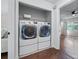 Laundry closet with modern stacked washer and dryer, conveniently located near the bedroom at 706 Twin Brooks Se Ct, Marietta, GA 30067