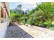 Brick patio with a view of the spacious backyard and a swing set; an area for relaxation at 1081 Singleton Valley Cir, Norcross, GA 30093