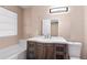 Bathroom featuring a modern vanity with a large mirror and bathtub with shower at 1081 Singleton Valley Cir, Norcross, GA 30093