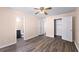 Bedroom featuring neutral walls, wood-look floors, closet, and an attached bathroom at 1081 Singleton Valley Cir, Norcross, GA 30093