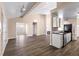 Bright and airy living space with wood-look floors, vaulted ceilings, and seamless transition to the kitchen at 1081 Singleton Valley Cir, Norcross, GA 30093
