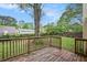 Wood deck and backyard with mature trees and lawn at 1248 Reilly Ln, Clarkston, GA 30021
