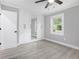Bright bedroom with light-gray walls, white trim, built in wardrobe and light floors at 1248 Reilly Ln, Clarkston, GA 30021
