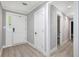Bright entryway with wood floors, a gray paint scheme, and white doors and trim at 1248 Reilly Ln, Clarkston, GA 30021