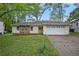 Charming single-story home featuring stone accents and a well-maintained front yard at 1248 Reilly Ln, Clarkston, GA 30021