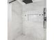 Elegant shower with tile surround, rainfall shower head, and built-in niche at 1248 Reilly Ln, Clarkston, GA 30021