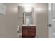 Modest bathroom featuring a vanity with a sink, mirror, and a toilet at 2230 Cheshire Bridge Rd # 412, Atlanta, GA 30324