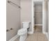 A clean bathroom with a toilet, shower, and linen closet at 2230 Cheshire Bridge Rd # 412, Atlanta, GA 30324