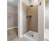 A shower stall next to a walk-in closet and beige tile flooring at 2230 Cheshire Bridge Rd # 412, Atlanta, GA 30324