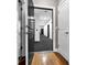 Apartment hallway with neutral walls, gray carpet and an EXIT sign above at 2230 Cheshire Bridge Rd # 412, Atlanta, GA 30324