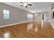 Spacious living room featuring hardwood floors, three windows, and neutral color walls at 2230 Cheshire Bridge Rd # 412, Atlanta, GA 30324