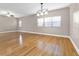 Spacious living room featuring gorgeous hardwood floors, and three large windows at 2230 Cheshire Bridge Rd # 412, Atlanta, GA 30324