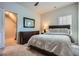 Comfortable bedroom with a large dresser, carpeted floors, and a walk-in closet for ample storage at 245 Fender Walk, Marietta, GA 30060