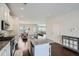 Bright modern kitchen with island, stainless appliances and white cabinets with an eat in dining area at 245 Fender Walk, Marietta, GA 30060