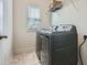 Efficient laundry room with modern washer and dryer set and ample natural light at 245 Fender Walk, Marietta, GA 30060