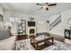 Inviting living room boasting hardwood floors, a cozy fireplace, and a staircase at 245 Fender Walk, Marietta, GA 30060