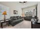 Inviting living room with two sofas, decorative lamps, and large windows at 245 Fender Walk, Marietta, GA 30060