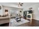 Bright living room featuring hardwood floors, stylish decor, and a cozy fireplace with mantle at 245 Fender Walk, Marietta, GA 30060