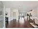 Open-concept living space featuring gleaming hardwood floors, lots of natural light, and modern finishes at 245 Fender Walk, Marietta, GA 30060