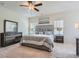 Spacious main bedroom featuring a plush bed, large windows, and tasteful decor at 245 Fender Walk, Marietta, GA 30060