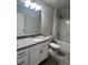 Bright bathroom with granite counters, modern vanity, tub, and shower combo at 80 Hawthorn Ln, Covington, GA 30014