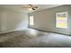 Spacious bedroom with new carpeting and windows providing natural light at 80 Hawthorn Ln, Covington, GA 30014