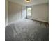 Bedroom with new carpeting, neutral walls, and natural lighting at 80 Hawthorn Ln, Covington, GA 30014