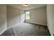 Bedroom featuring neutral color paint, plush carpet, and natural light at 80 Hawthorn Ln, Covington, GA 30014