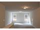 Bonus room with neutral walls, carpet and natural lighting at 80 Hawthorn Ln, Covington, GA 30014