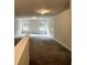 Bonus room with neutral walls, carpet and natural lighting at 80 Hawthorn Ln, Covington, GA 30014