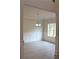 Bright dining room featuring paneled walls, hardwood floors, and a modern chandelier at 80 Hawthorn Ln, Covington, GA 30014