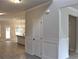 Open-concept kitchen with stainless steel appliances, granite countertops, and hardwood floors at 80 Hawthorn Ln, Covington, GA 30014
