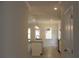 Bright kitchen features granite countertops, hardwood floors, stainless appliances and pendant lights at 80 Hawthorn Ln, Covington, GA 30014
