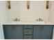 Double sink bathroom vanity with elegant wall lighting, undermount sinks, and modern fixtures at 1059 Dryden Ln # 11, Atlanta, GA 30319
