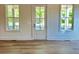 Bright entryway featuring sleek flooring, a front door with windows, and natural lighting at 1059 Dryden Ln # 11, Atlanta, GA 30319