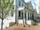 Beautiful light brick two story home features a welcoming front porch and black wrought iron fencing at 1059 Dryden Ln # 11, Atlanta, GA 30319