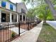 Beautiful light brick two story home features a welcoming front porch and black wrought iron fencing at 1059 Dryden Ln # 11, Atlanta, GA 30319