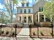 Beautiful light brick two story home features a welcoming front porch and black wrought iron fencing at 1059 Dryden Ln # 11, Atlanta, GA 30319