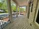Charming covered front porch with brick flooring and white columns at 1059 Dryden Ln # 11, Atlanta, GA 30319