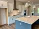 Modern kitchen featuring a large island, stainless steel appliances, and stylish pendant lighting at 1059 Dryden Ln # 11, Atlanta, GA 30319