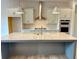 Modern kitchen features a large center island and stainless steel appliances at 1059 Dryden Ln # 11, Atlanta, GA 30319