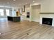 Spacious living room features modern fireplace, and seamlessly flows into the open kitchen area at 1059 Dryden Ln # 11, Atlanta, GA 30319