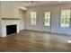 Bright living room features a cozy fireplace and large windows offering ample natural light at 1059 Dryden Ln # 11, Atlanta, GA 30319
